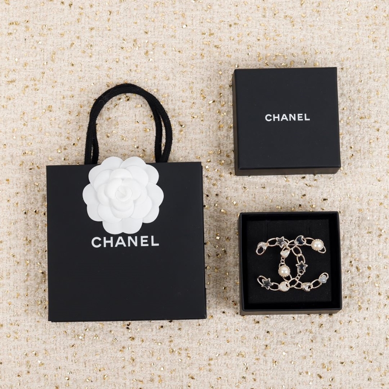 Ch*el brooches